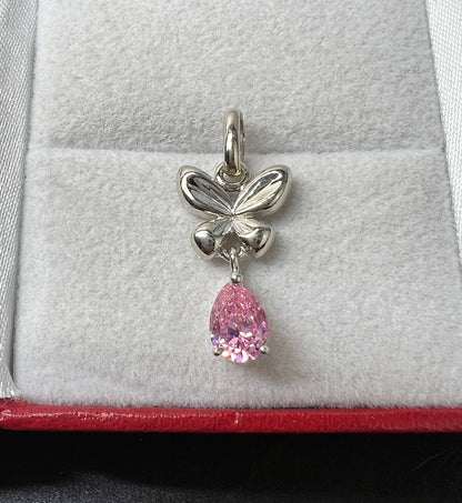 Dije Mariposa Oro Blanco 14kt con Zirconia Rosa